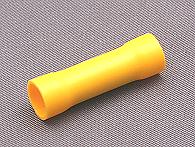 Yellow pre insulated butt connector.